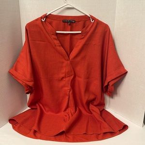 Women’s size 2x burnt orange blouse with cuffed sleeve and pleaded front closure